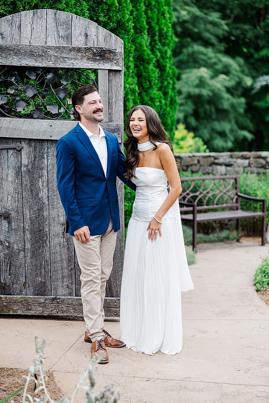 happy couple laughing at garden engagement session
