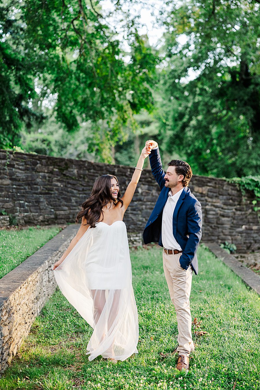 man twirling woman