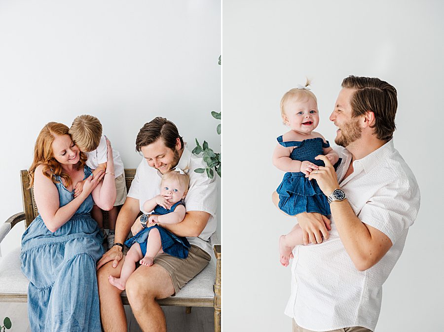 dad holding daughter at white room one year session