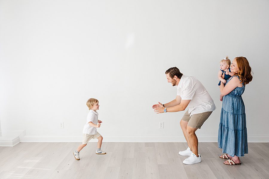 son running to dad at white room one year session