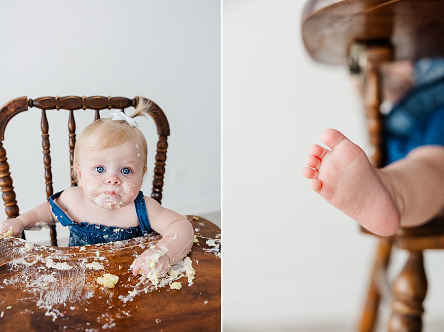 little girl doing cake smash