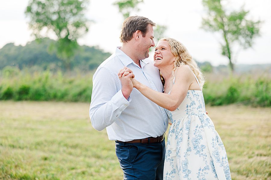 couple dancing at golden hour at rainy marblegate engagement