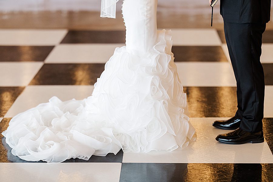 bride's dress train at summer press room wedding