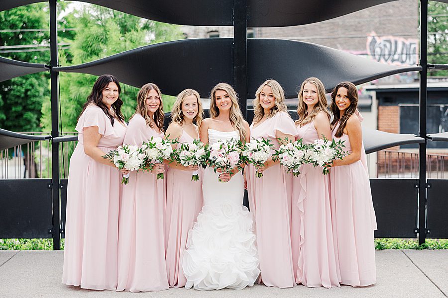 bride and bridesmaids before summer press room wedding