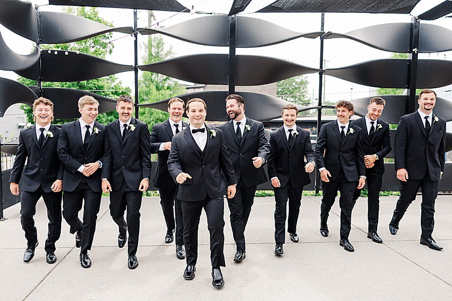 groom and groomsmen before summer press room wedding