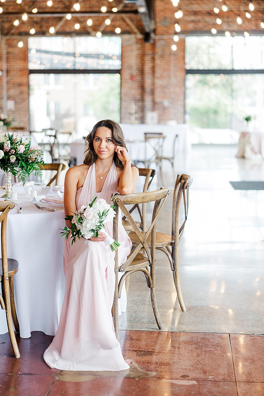 bridesmaids sitting in reception before summer press room wedding