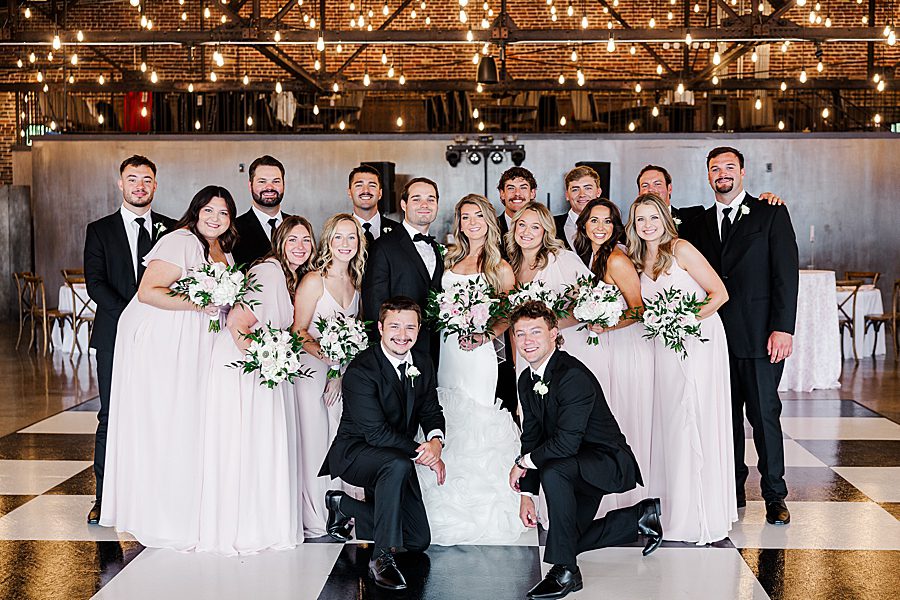 large bridal party before summer press room wedding