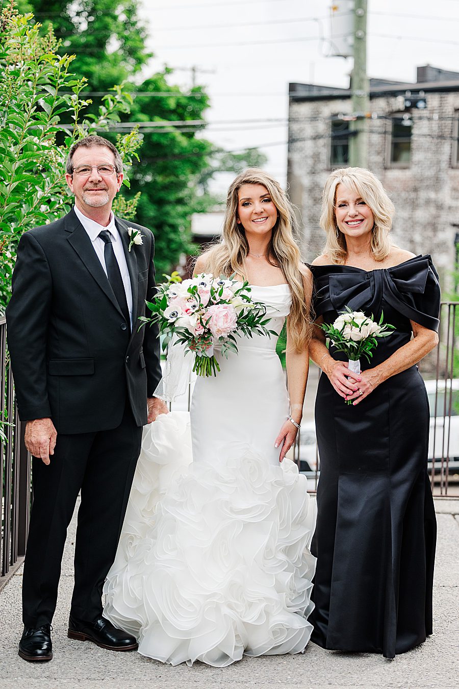bride and parents before walking down aisle at summer press room wedding