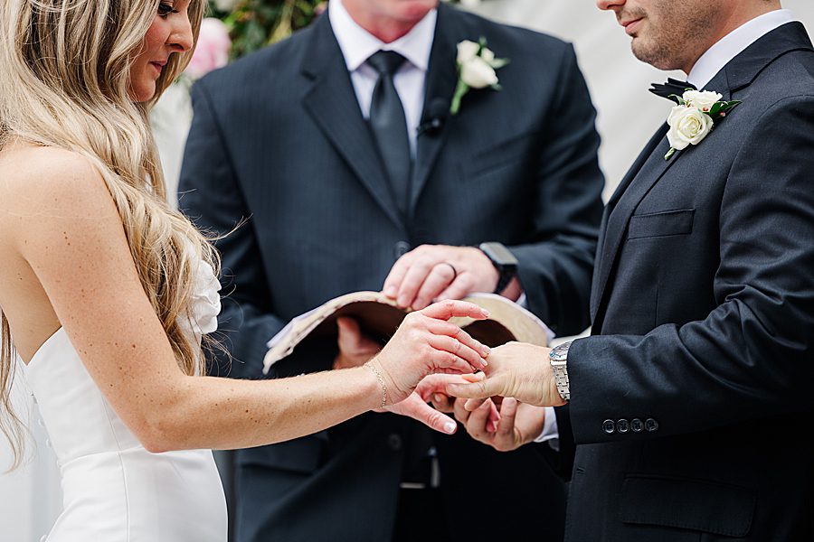 exchanging rings at summer press room wedding