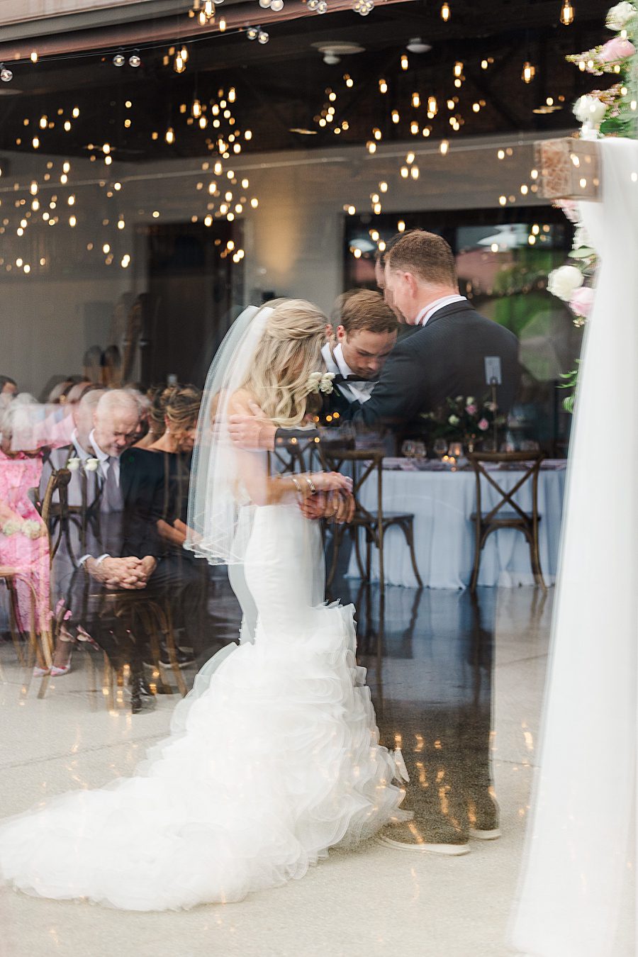 reflection in mirror at summer press room wedding