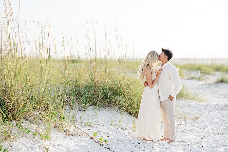 kiss on forehead at anna maria island anniversary session