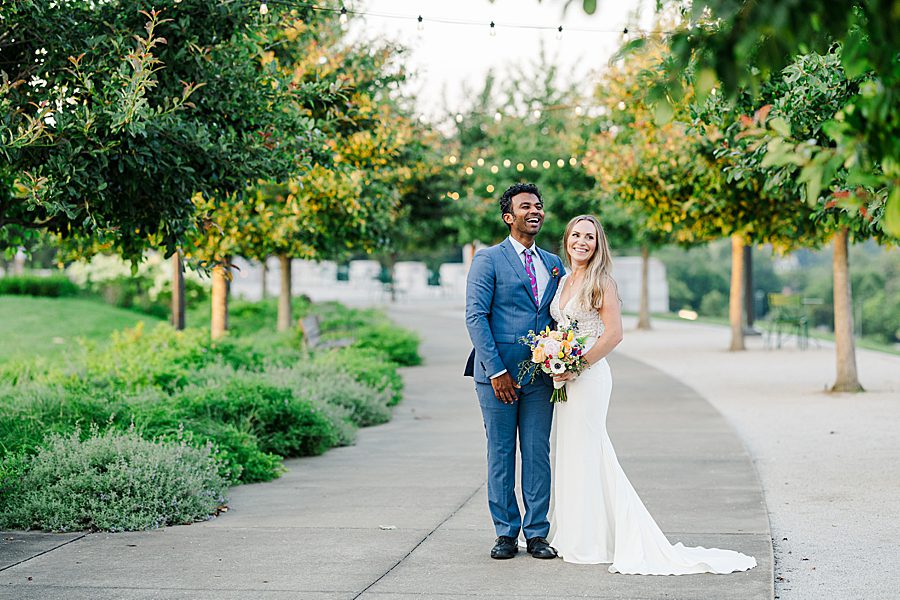 couple in traditional wedding attire at lakeshore park wedding portraits