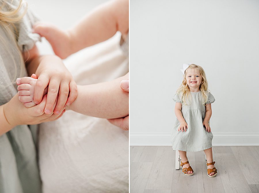 little kid hands at white room family session