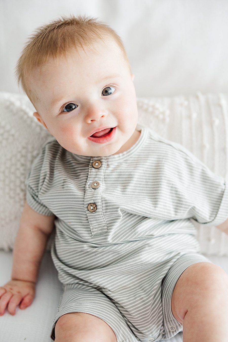 baby boy at white room family session
