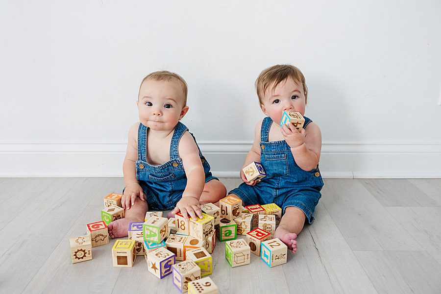 boys playing with blocks at nine month twins milestone session