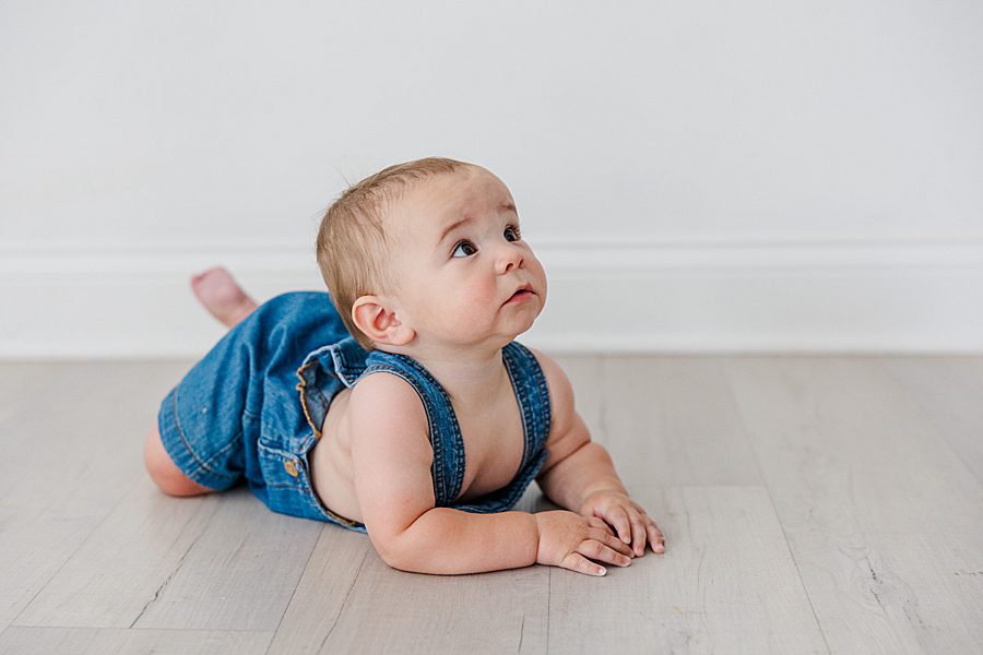 little boy laying on stomach during photo session