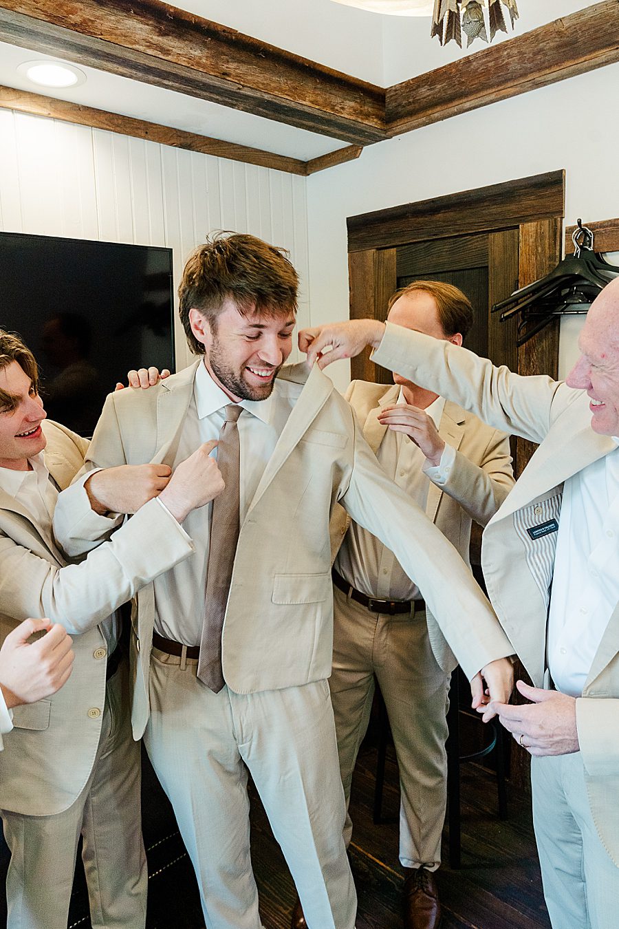 groom getting ready for wildflower event center wedding
