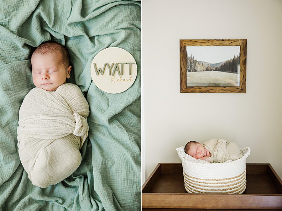 baby laying in basket under artwork