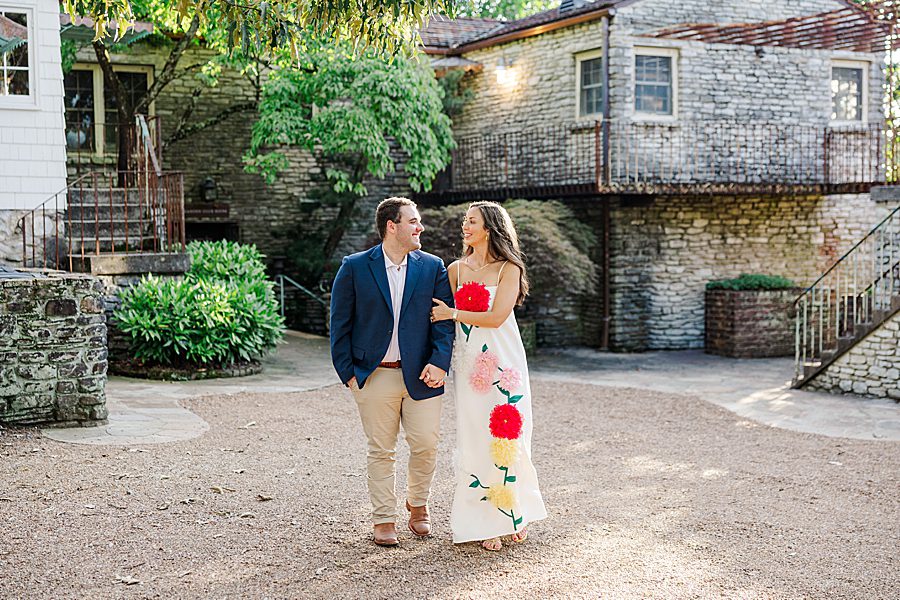 couple holding hands at golden hour