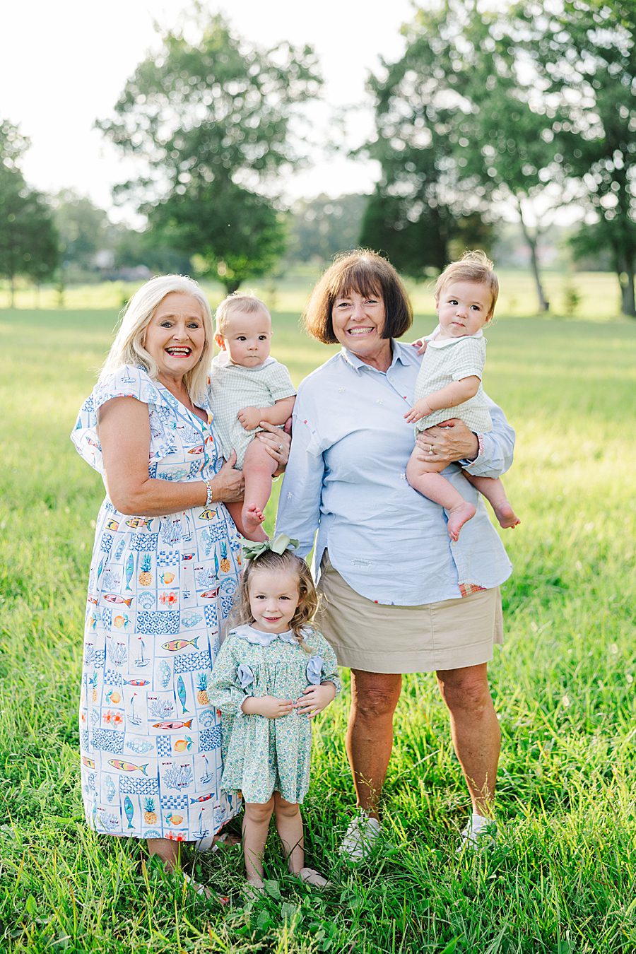 grandmothers holding grandchildren during photography session