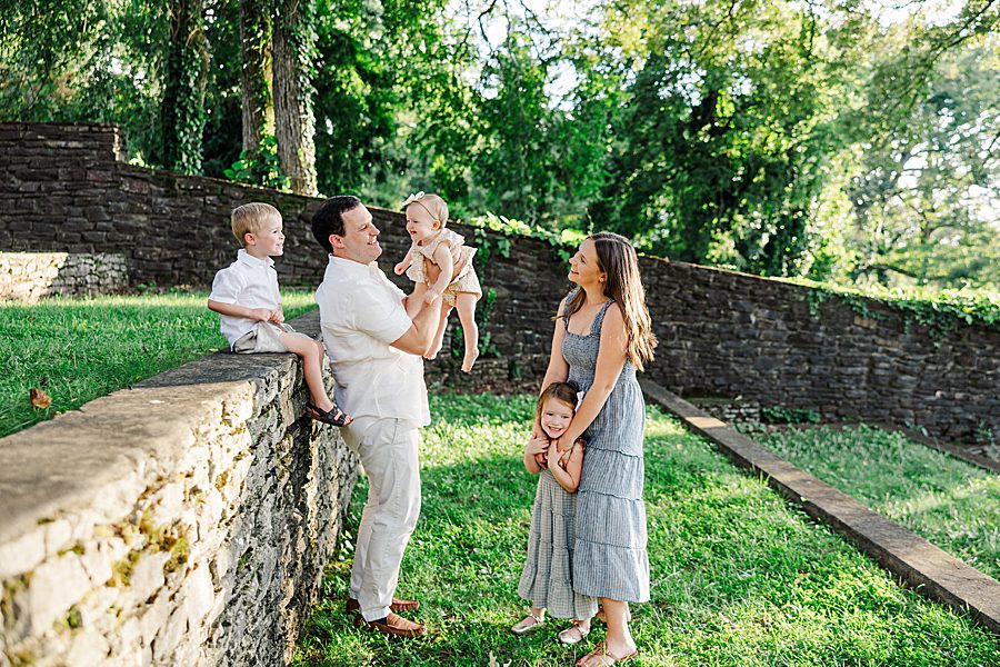 family of five playing together during golden hour