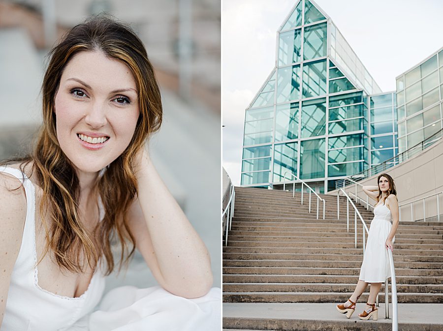 woman in white sundress leaning against stair railing at colorful stairs senior session