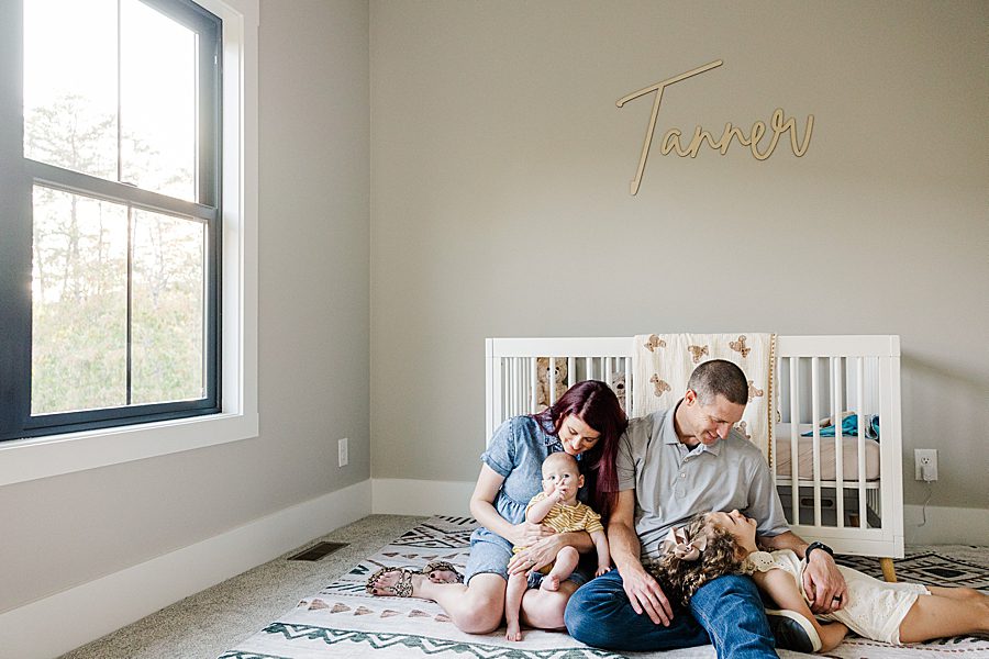 family in nursery at powell home milestone session