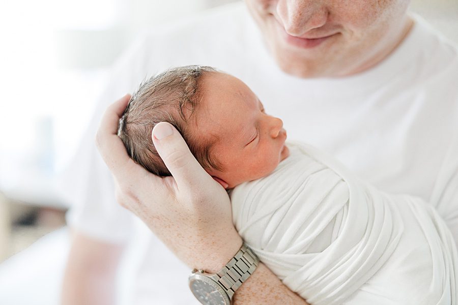 dad holding son at chattanooga newborn session