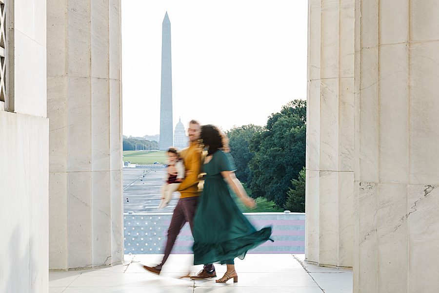 blurred photo of family in front of washington monument