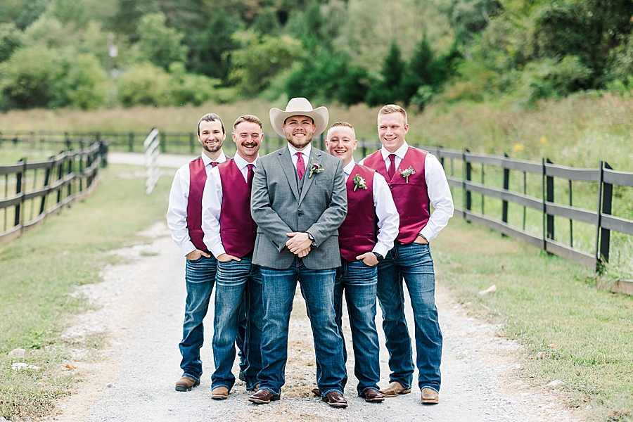 groom posing with groomsmen