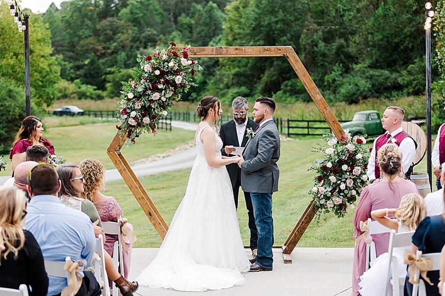exchanging vows at 4 points farm wedding