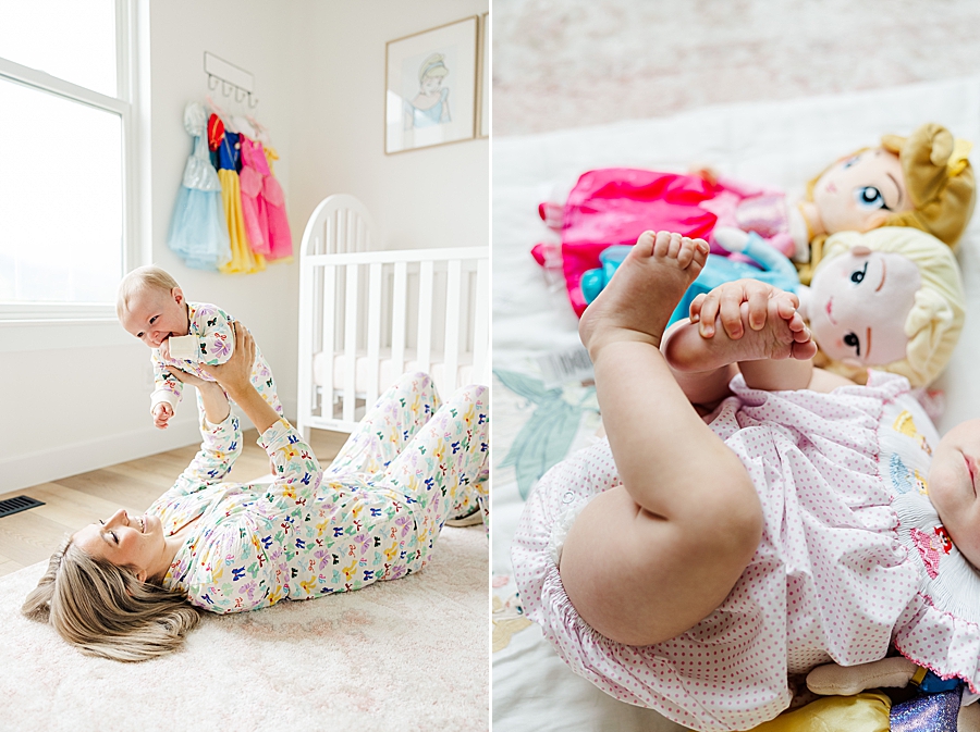 mom playing airplane with baby girl