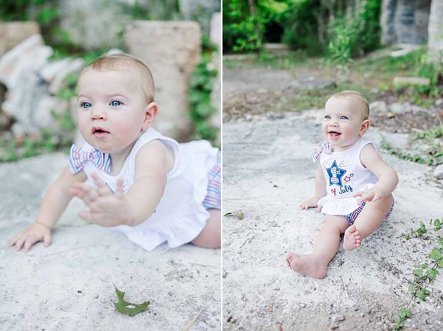 little girl climbing on rocks at 9 month meads quarry session