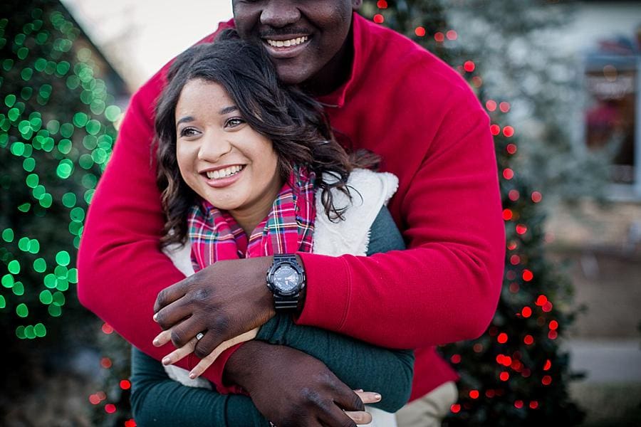 Hugging her from behind at this Christmas Place engagement session by Knoxville Wedding Photographer, Amanda May Photos.