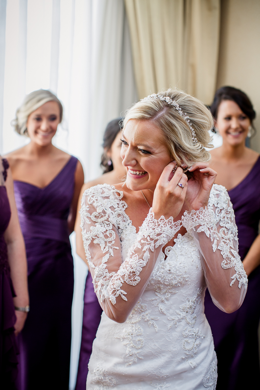 Historic Westwood in Knoxville, TN bride putting earrings on.