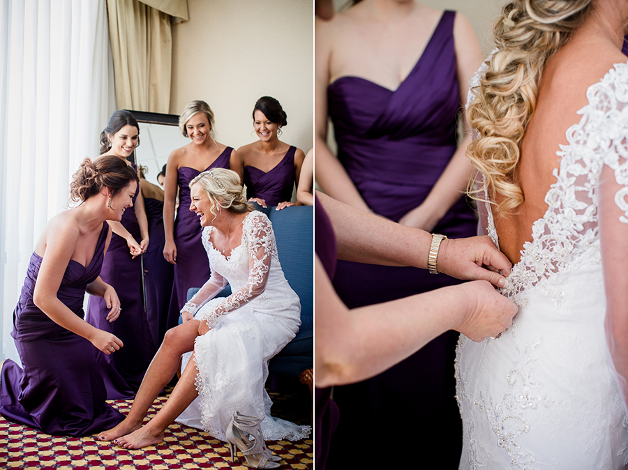 Historic Westwood in Knoxville, TN bridesmaid putting shoes on bride.