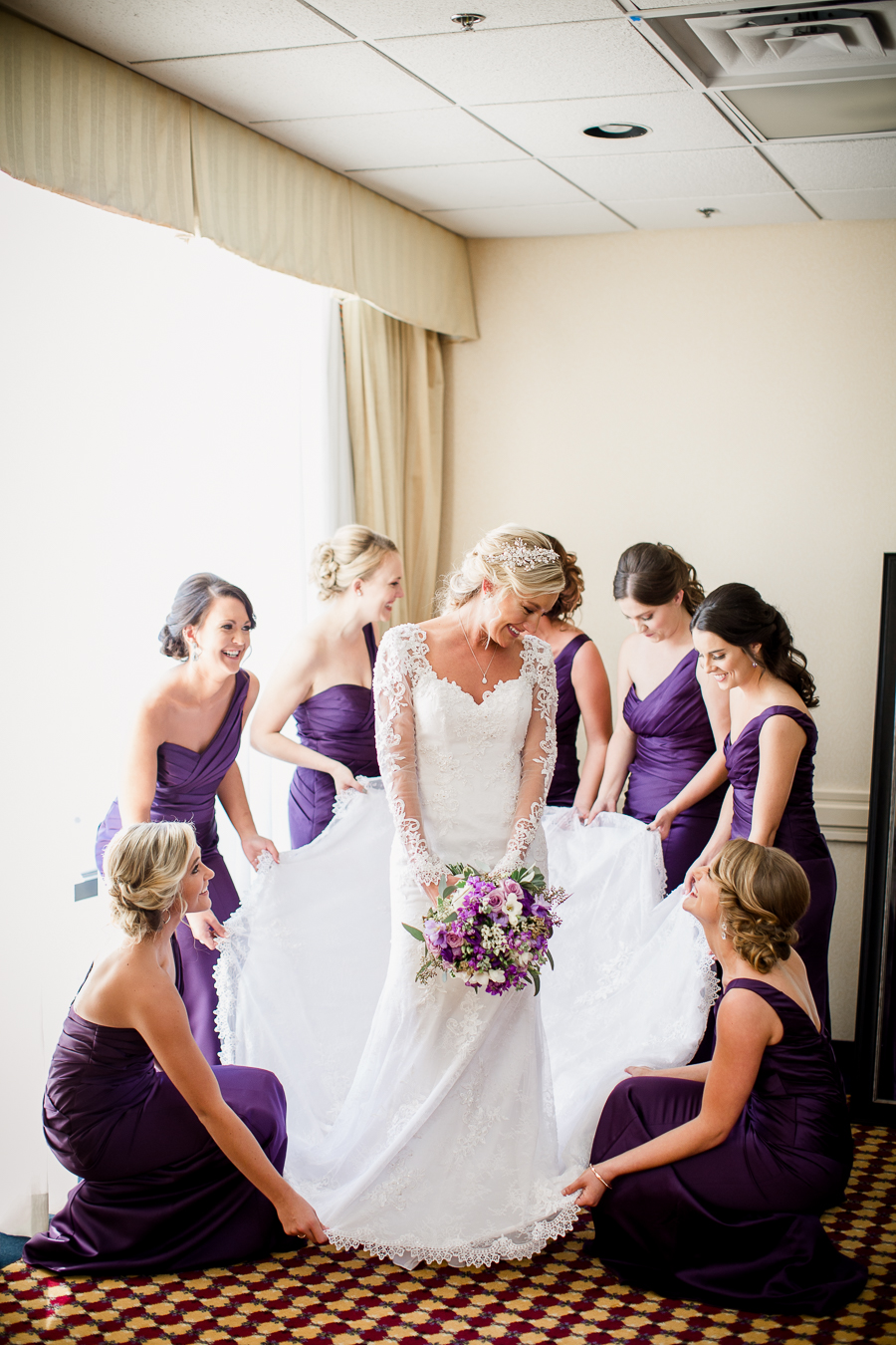 Historic Westwood in Knoxville, TN bridesmaids holding the wedding dress train.