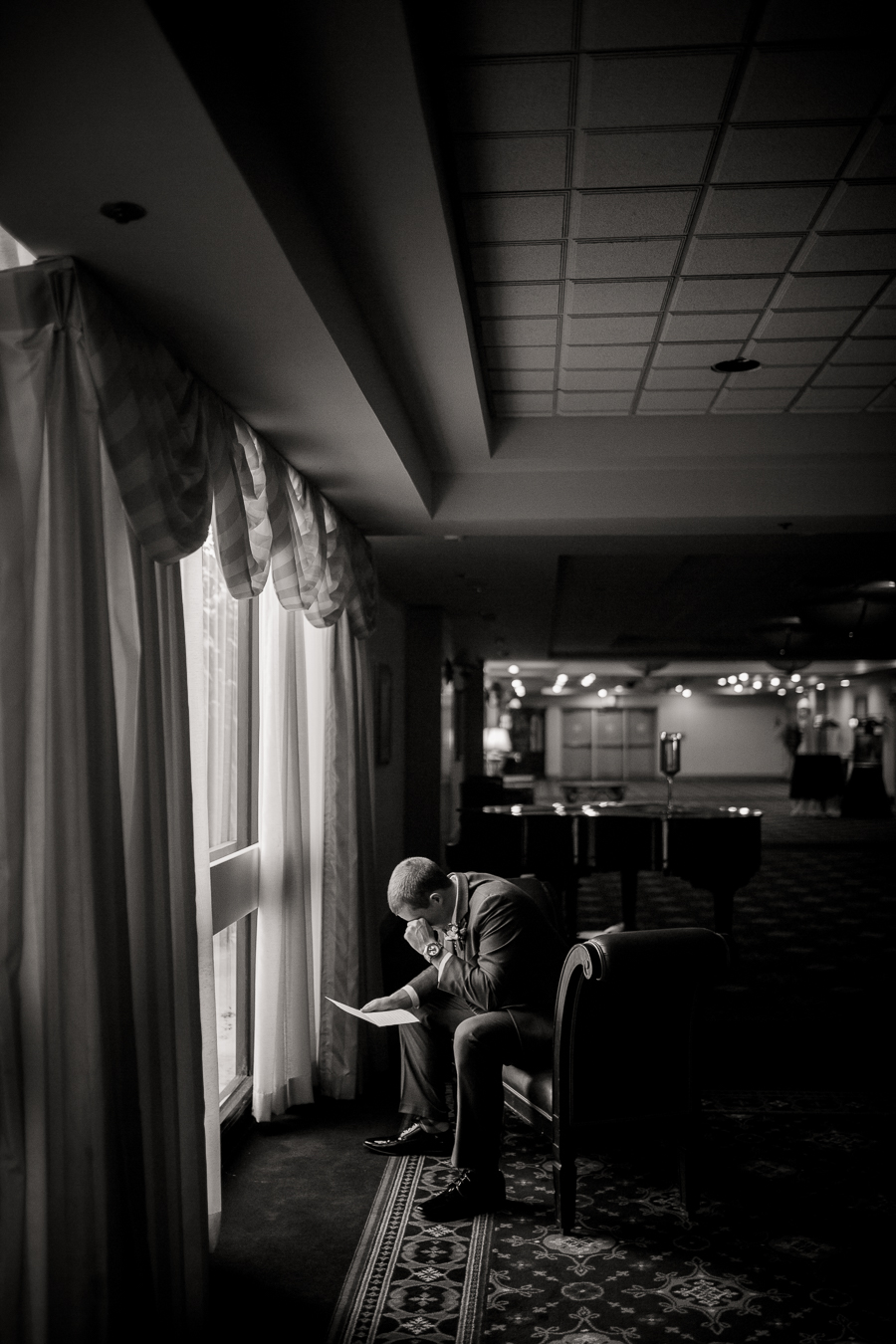 Historic Westwood in Knoxville, TN groom reading his letter from the bride.