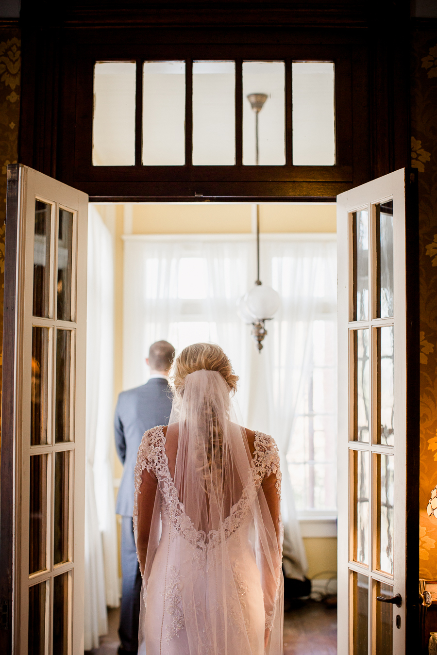 Historic Westwood in Knoxville, TN bride approaching her groom during first look.