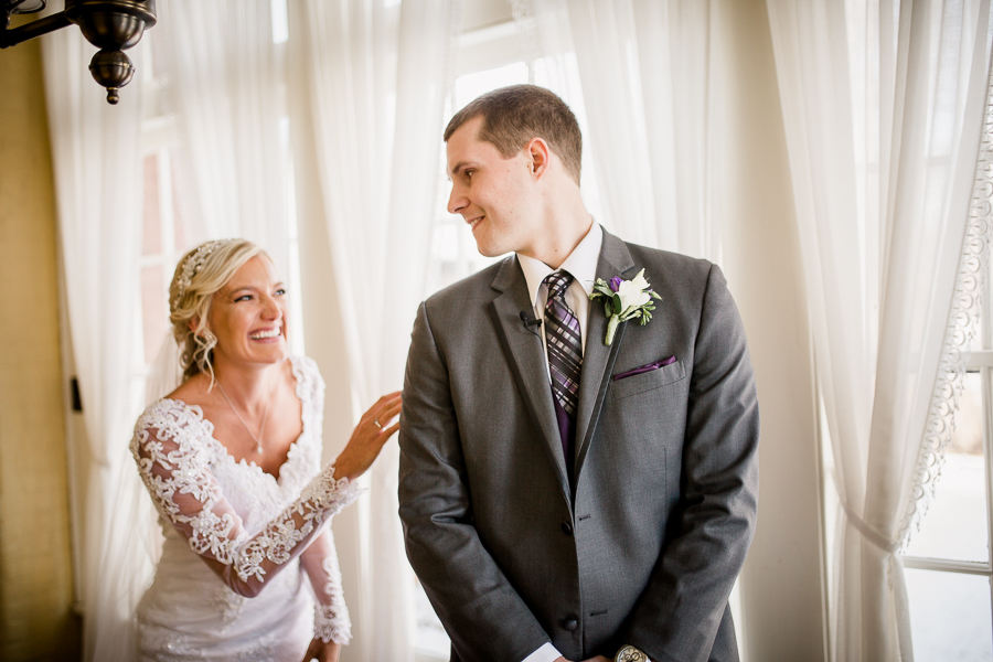 Historic Westwood in Knoxville, TN groom turning around to see his bride during first look.