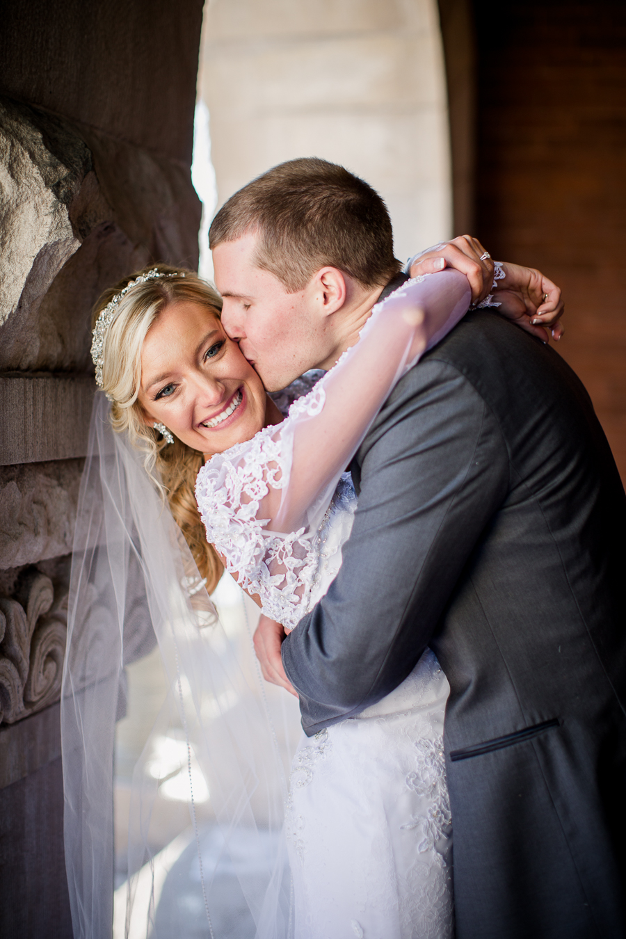 Historic Westwood in Knoxville, TN groom kissing bride's cheek.