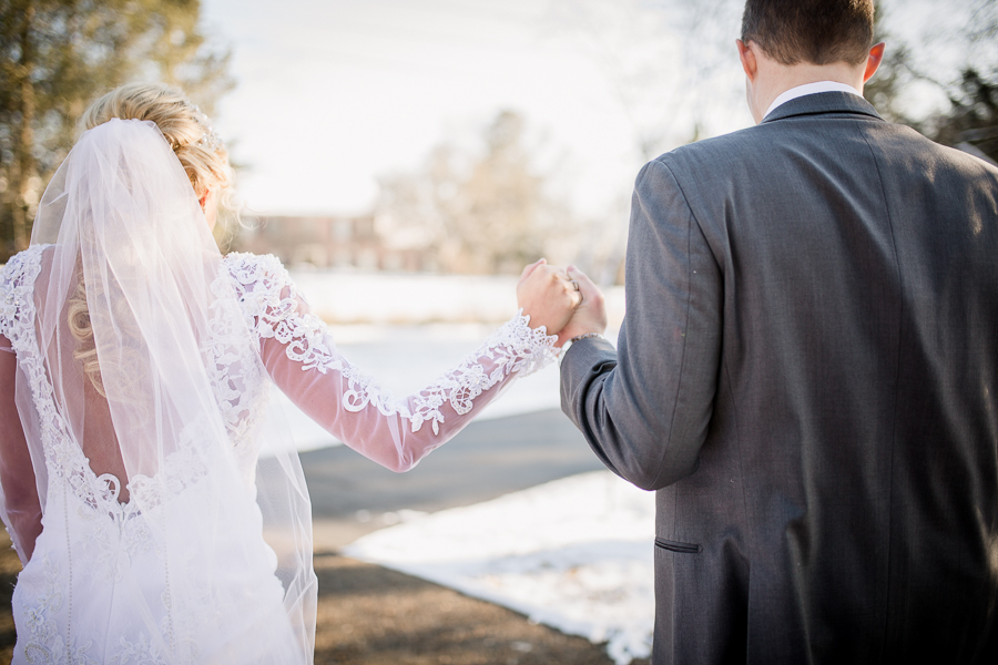 Historic Westwood in Knoxville, TN groom escorting bride in snow.