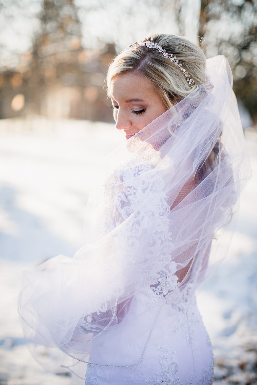 Historic Westwood in Knoxville, TN bride looking over her shoulder in her veil photo.