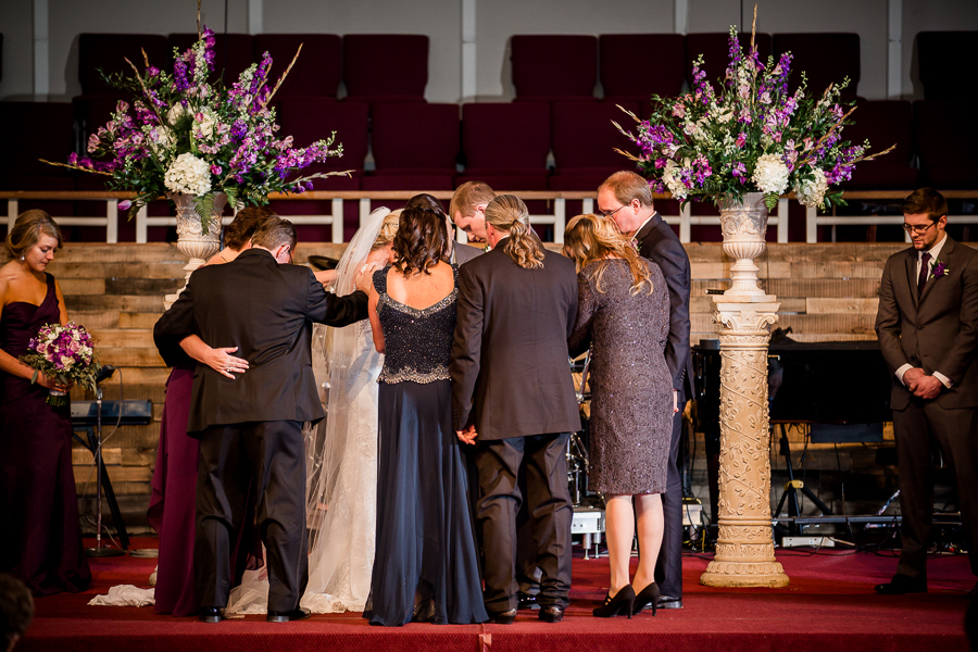 Historic Westwood in Knoxville, TN family praying for bride and groom photo.