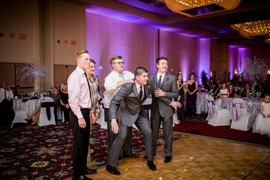 Historic Westwood in Knoxville, TN groomsmen catching garter photo.