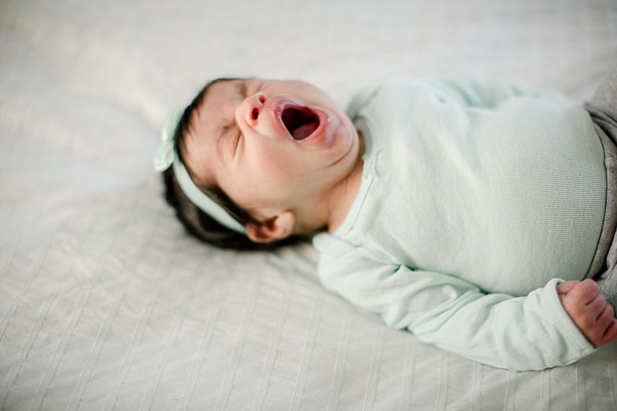 Yawning at this newborn lifestyle session in the studio by Knoxville Wedding Photographer, Amanda May Photos.