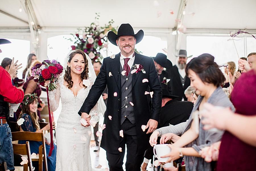 Throwing rose petals at this Arrington Vineyard wedding by Knoxville Wedding Photographer, Amanda May Photos.