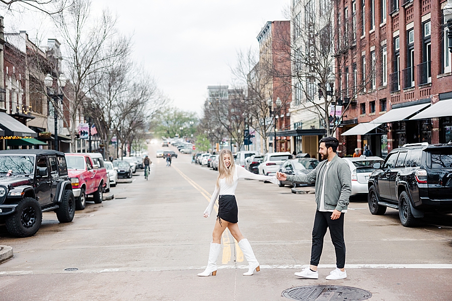 She's leading him across the street at this downtown Knoxville proposal by Amanda May Photos.
