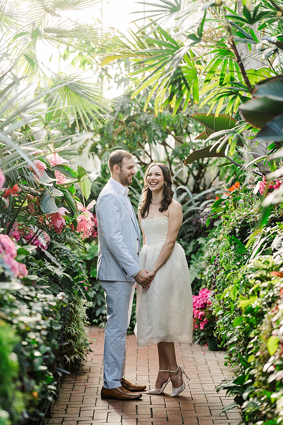 couple standing in conservatory at biltmore engagement
