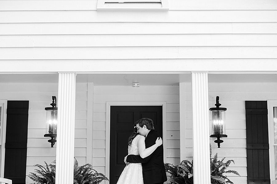 Bride and groom hugging at Julianna Wedding by Amanda May Photos